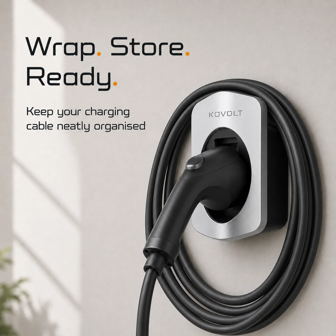 A Type 2 charging cable wrapped neatly around the wall-mounted Kovolt Mount.